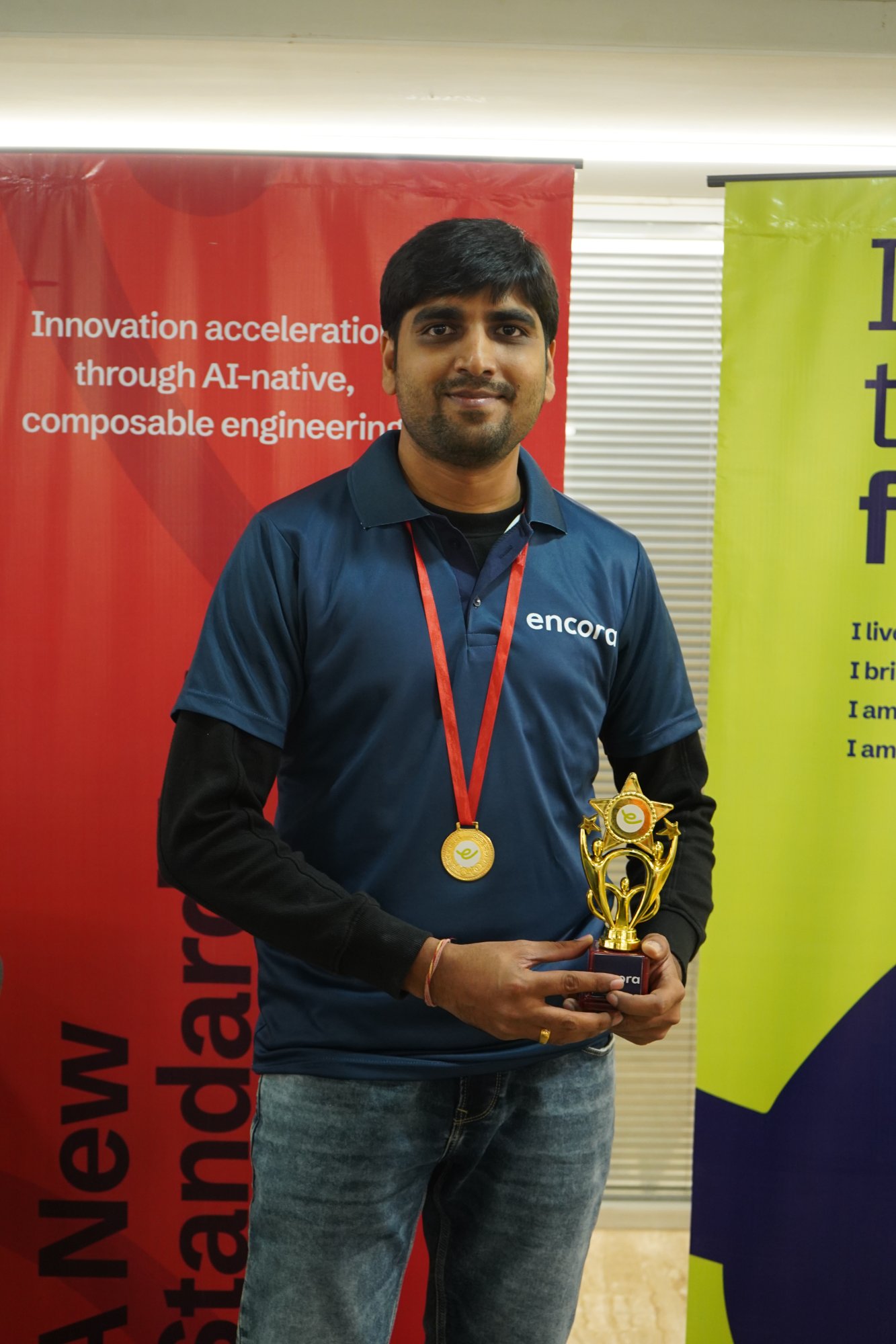 Mahavir Vora receiving chess trophy at Encora